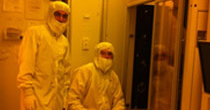 two undergraduate students suited up in the Nanofabrication Laboratory cleanroom